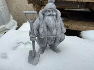 Santa Claus with a snow shovel