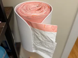 Trash Bag Tamer: Simple dispensing for big rolls