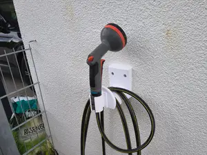 Wall Hose Holder with Integrated Sprayer Bracket