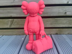Kaws Companion Holding a Duffle bag