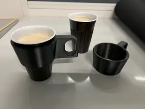 Cup holder for coffee machines