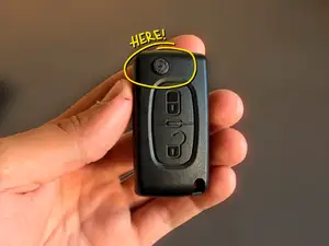 Peugeot flip key mechanism button