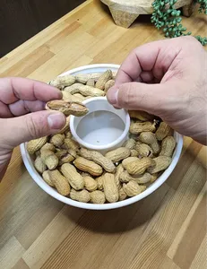 Peanut dispenser with waste disposal