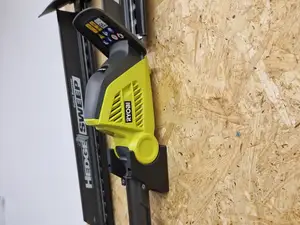 Vägghållare Ryobi Stånghäcksax
