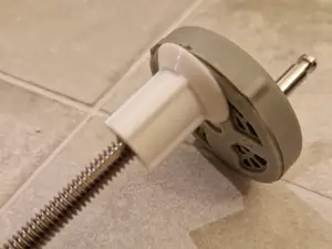 Toilet seat plug