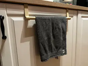 Kitchen cabinet door towel hanger