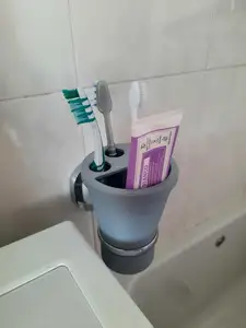 Glass for toothbrushes and cap