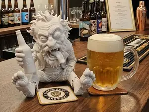 Old man - alcoholic, cheerful bar decoration