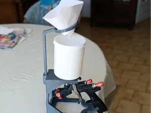 Spray gun holder with paint filter holder.