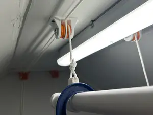 Ceiling mounted clothes dryer