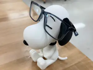 Snoopy eyeglasses holder or statue