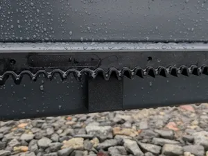 Toothed rack cover for entrance gate.