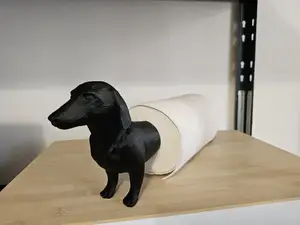 Wiener dog paper towel holder.