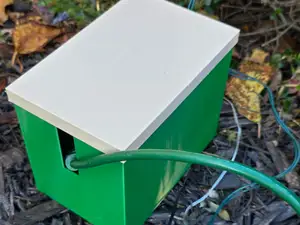 Outdoor extension cord outlet adapter box with lid