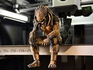 Sad Predator Figurine sitting on a ledge!