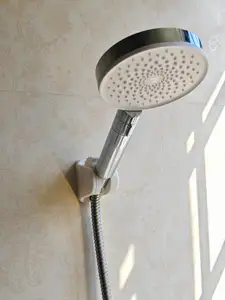 Adjustable shower head holder