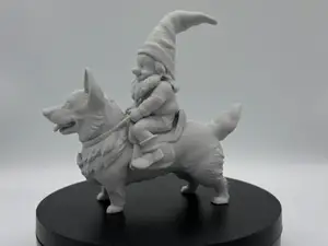 Gnome riding on a Corgi