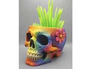 Skull flowerpot with flower