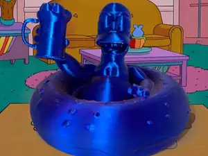 Homer Simpson et sa Bière dans sa Bouée Donuts