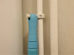 broom holder for pipe