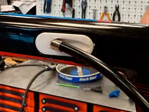 Bicycle brake cable internal routing stop