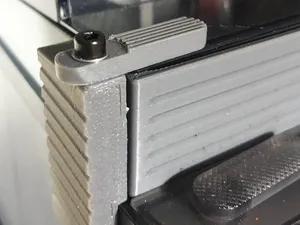 AMS riser pivot lock tab