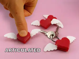 Articulated heart keychain with wings