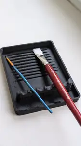 Stand for brushes.