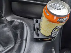 Improved Corvette C5 cupholder with locking tab