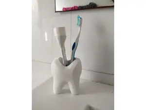 A cup for toothbrush and toothpaste