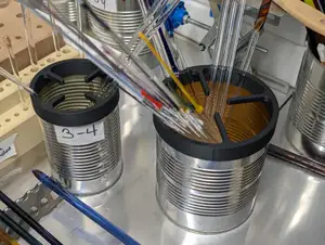 Tin can organizer for glass rods or other long narrow items