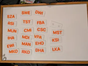 Magnetic Nametag / Acronym plate generator (openscad + bash script)