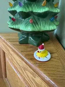 Christmas Ornament - Duck with Santa Cap sitting on a Donut.