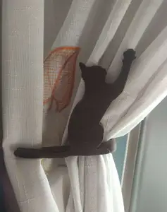 feline curtain holder