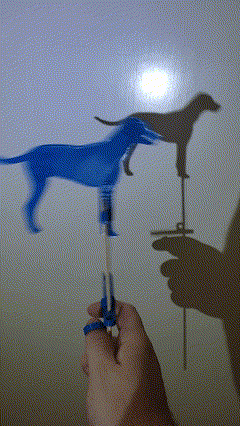 Dog shadow puppet with moving mouth and tail