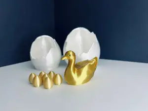 Golden goose with hatched egg and 7 golden eggs
