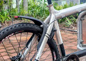 Bicycle mudguard with integrated LED tail light.