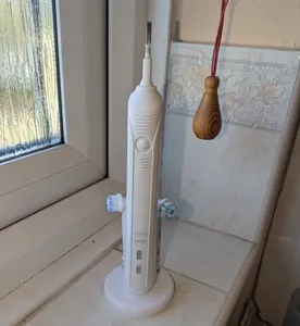 Oral-B (Braun) Electric Toothbrush Stand - REMIX to add storage for 2 heads.