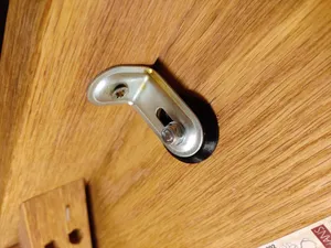 Mounting pad for wooden seats