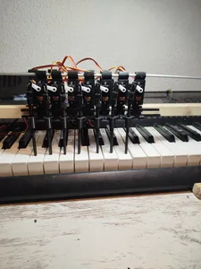 Piano robot. Synchronized Servo Motion for MIDI Playback