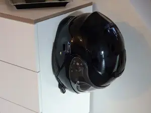 Motorcycle helmet holder without screws