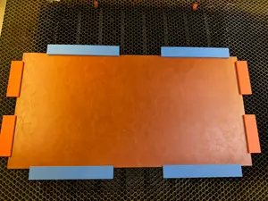 Magnet bars for laser beds