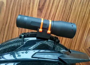Universal flashlight helmet mount
