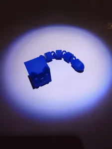 Articulated boxy cat fidget toy.