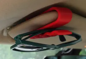 Sunglasses holder for sun visor in car