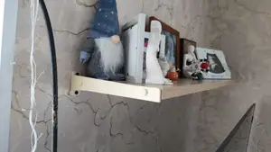 A shelf bracket made of 16mm laminated chipboard.
