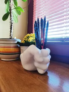 Fist pen cup