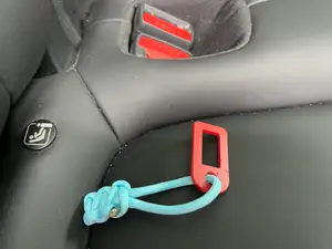 Safety belt alert stopper especially for folded back seats
