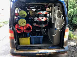 Fully adjustable, quickly removable, low profile van rack for windsurfing