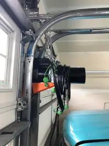 Wall-mounted shelf for QuickJack power unit